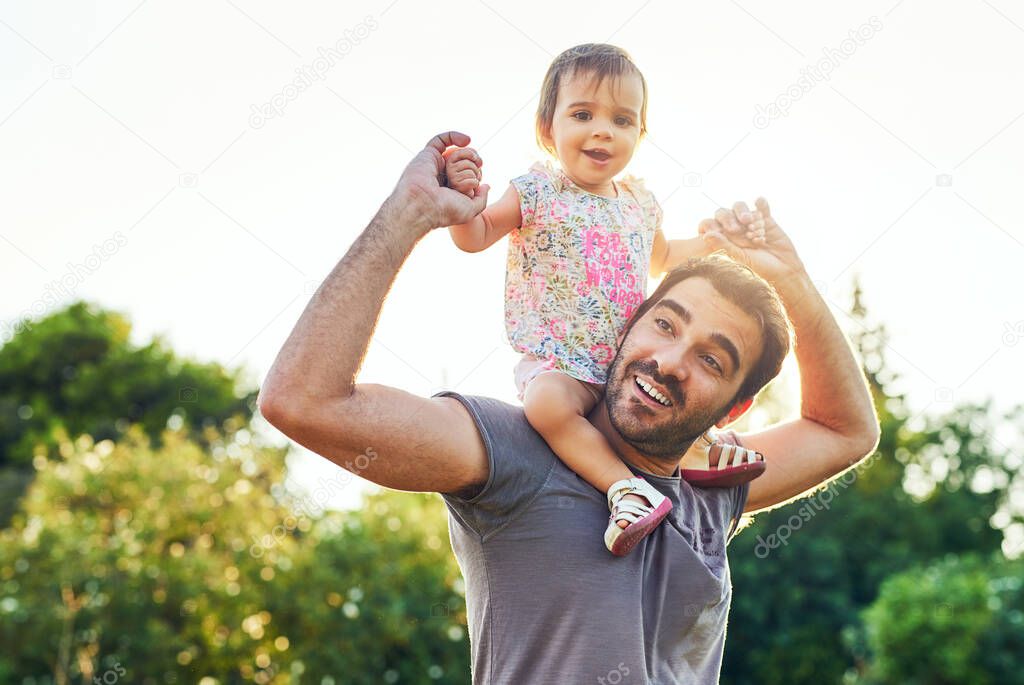 Now you have a better view. a young father with his little girl outdoors