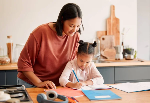 Mother Teaching Daughter Doing Homework Kitchen Table Home Bonding While — Stok fotoğraf