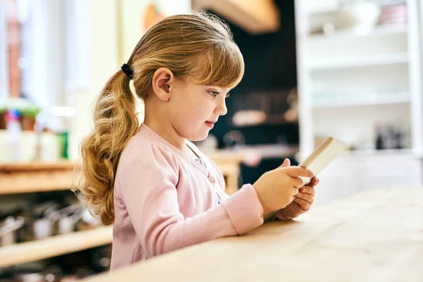 Can Fun Indoors Cheerful Little Girl Busy Playing Digital Tablet — Stock Fotó