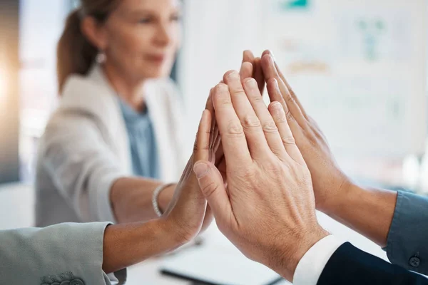 Hands of corporate, businesspeople or staff together in solidarity, unity and collaboration for common vision and mission. Trust team building group meeting of business professionals at office.