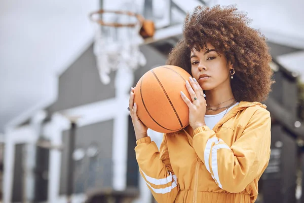 Cool basketball player with funky, confident and hipster attitude ready for game, fun or playing outdoor sports match. Portrait of young, fashion and beautiful black woman with afro ready for fitness.
