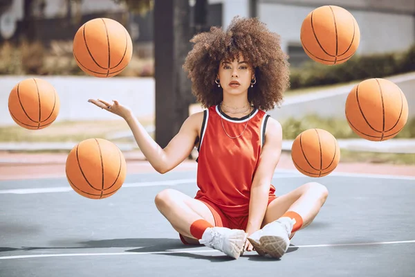 Female basketball player sitting with balls in the air on a court, learning fitness training and doing sport exercise and workout outside. Portrait of a black woman playing game and looking confident.