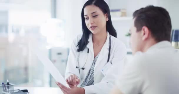 Doctor Explaining Test Results Male Patient Consultation Hospital Young Man — Vídeos de Stock