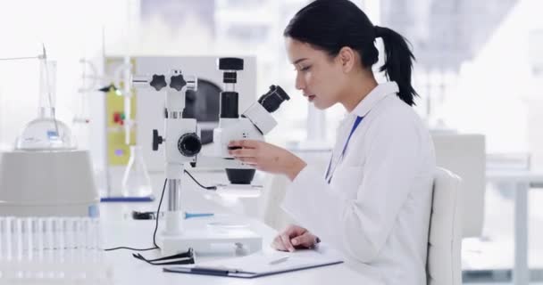 Young Female Scientist Microscope Doing Paperwork Science Innovation Clinical Trial — Stockvideo