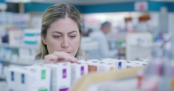 Confused Woman Shopping Medicine Shelves Retail Pharmacy Store Reading Label — Stock video