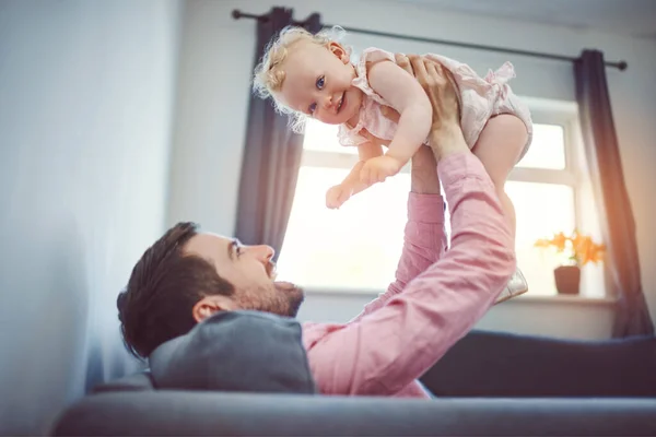 When Im happy, daddys happy. a young man spending quality time with his adorable daughter at home