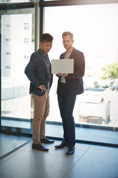 Boosting Productivity Technology Two Businessmen Discussing Something Laptop Office — Stockfoto