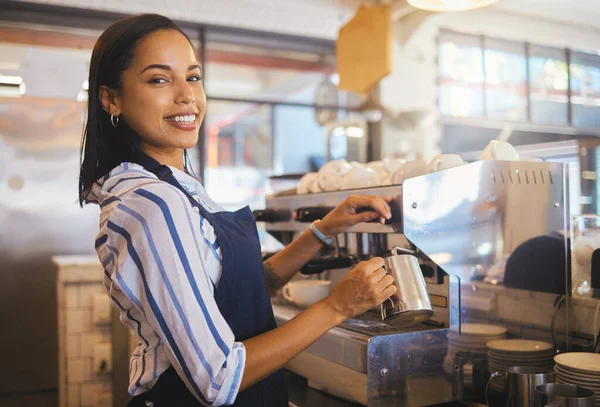 Barista preparing drink in coffee shop, cafe startup and hospitality restaurant. Portrait of friendly waitress, happy bistro worker and young woman steaming milk for hot cappuccino and waiter service.