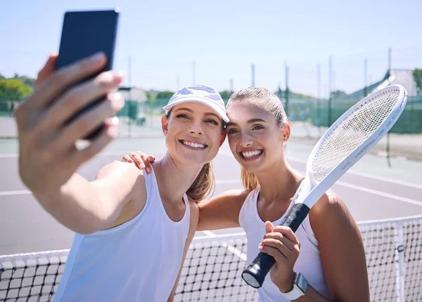 Tennis, selfie and sports women friends on a court in the summer for exercise. Happy, face and smile woman in a sport together in health, fitness and wellness in training workout and motivation