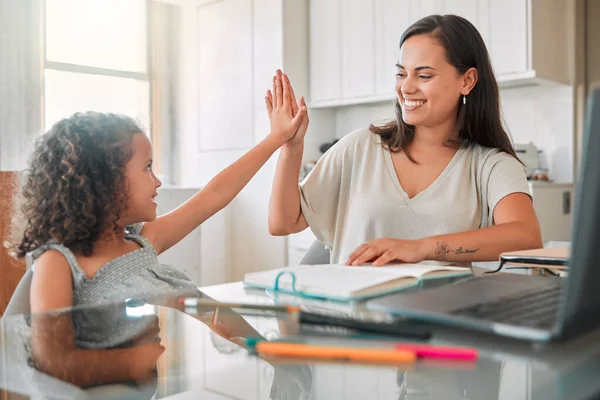 High five, homework and mom celebrating with preschool student for learning, goals and writing notes successfully. Teamwork, smile, and happy mom celebrates education with her kindergarten baby girl.