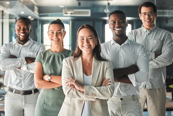 Portrait of team, posing in the office in a business meeting and smiling. Professional ceo, management and employees showing good teamwork with diverse, young and multiracial workers