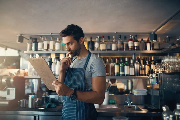 Looks Ill Have Order More Young Man Using Clipboard While — Stock Photo, Image