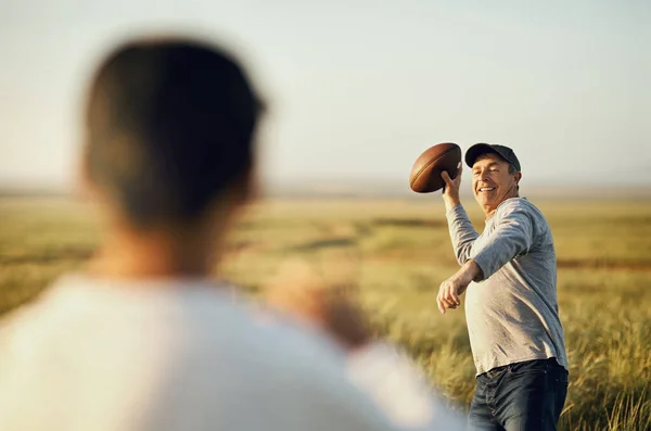 Putting His All Father Son Playing Football Open Field — Foto de Stock