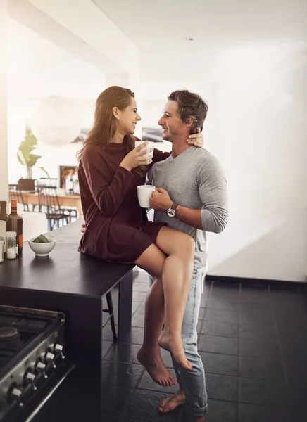 You are just what my heart needs. an affectionate young couple having a coffee break at home