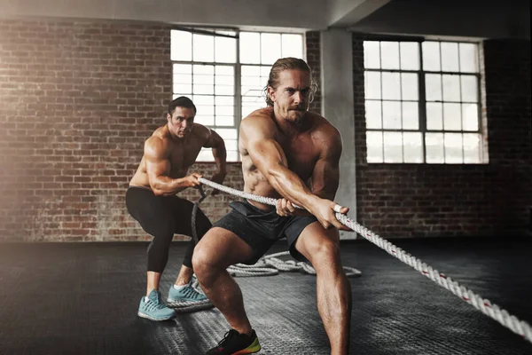Youre Getting Stronger Every Second Two Muscular Young Men Pulling — Stock Photo, Image