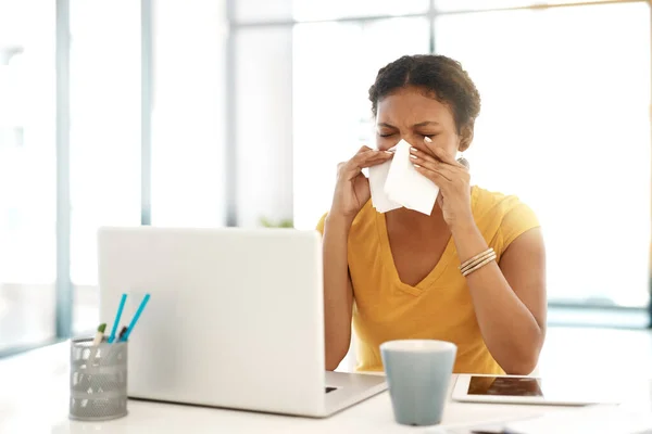 Season Sniffles Young Businesswoman Blowing Her Nose Her Desk Modern — Zdjęcie stockowe