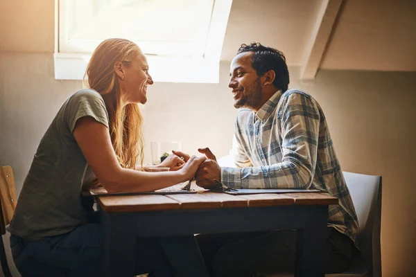 I look at you and see the one I need. a young couple spending time together at a cafe