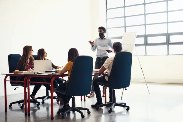 Success begins when we join together and create. creative employees having a meeting in a modern office