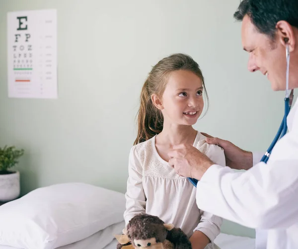 Visiting Doctor Punishment Male Doctor Checking His Young Patients Heart — Zdjęcie stockowe