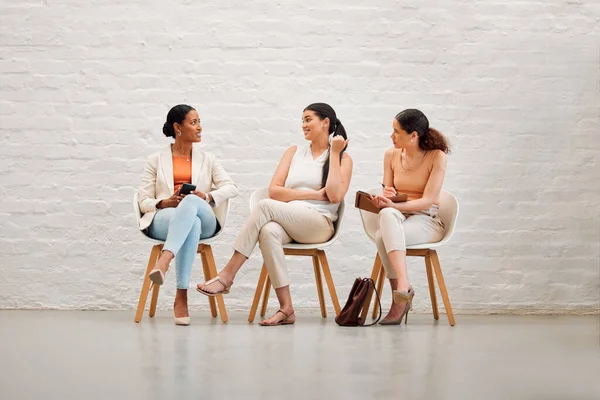 Women in waiting room for interview, hiring or recruitment meeting with hr for fashion designer job. Creative girls or future company employees in search of employment in design industry field.