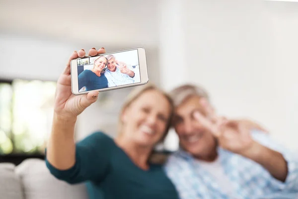 Peace Out Affectionate Mature Couple Taking Selfies Together While Sitting — Foto Stock