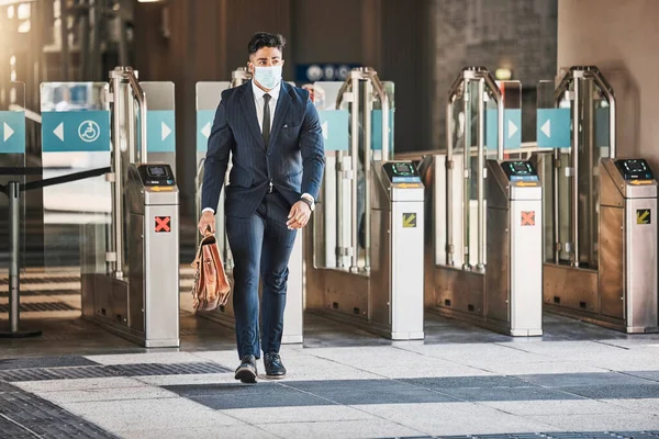 Travel business man during covid arriving in urban city at bus, train or airport terminal. Corporate businessman, employee or worker with suitcase walking in the street to hotel or meeting with mask.
