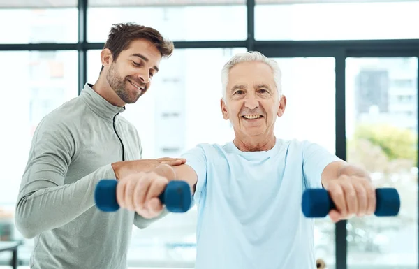 Can You Feel Friendly Physiotherapist Helping His Senior Patient Work — Stockfoto