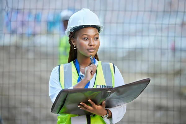 Construction worker, maintenance and development woman thinking with documents at work. Building management employee with a vision for improvement or plan for contractor or builder at the job site