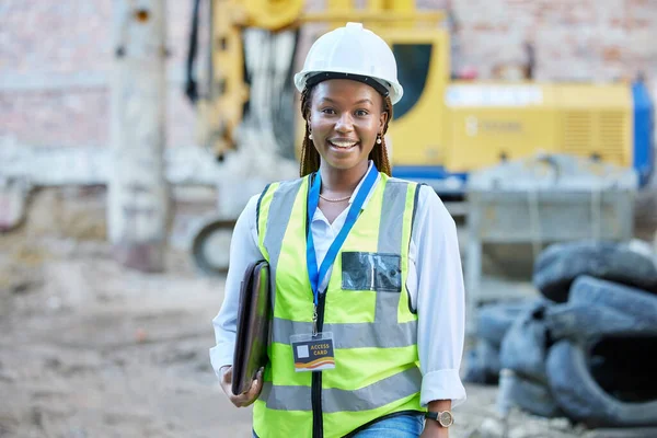 Happy engineer, construction worker or architect woman feeling proud and satisfied with career opportunity. Portrait of black building management employee or manager working on a project site.