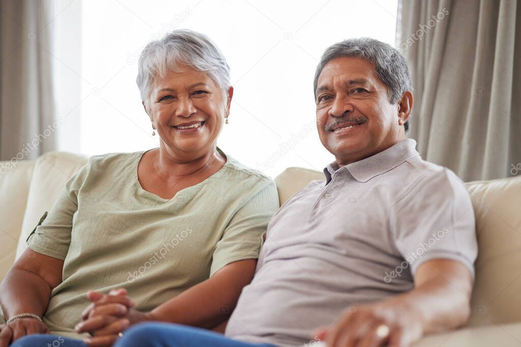 Love, smile and senior couple on living room interior sofa relax and lounge together at home portrait. Face of happy people, man and woman smile while living retirement lifestyle at family house.
