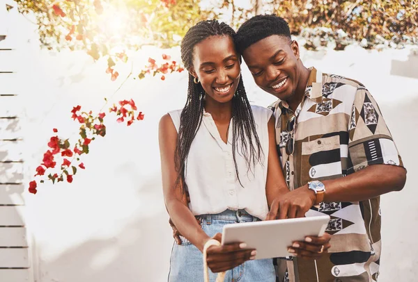 Digital influencer couple with tablet on social media app reading online notification or a funny internet post. Summer content creator, friends or in love people search for inspiration on a website.