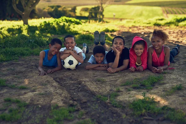 Footballers Making Group Children Lying Together Soccer Ball Some Grass — Stok fotoğraf