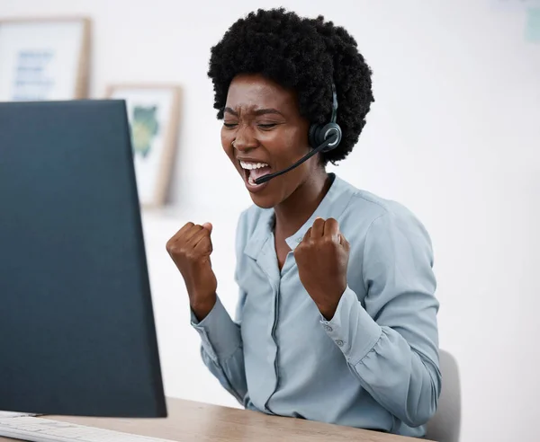 Happy business woman meeting target, excited black girl in corporate and virtual assistant hired. Dark skin African at work, home office desk, computer headphones and remote work team online call.