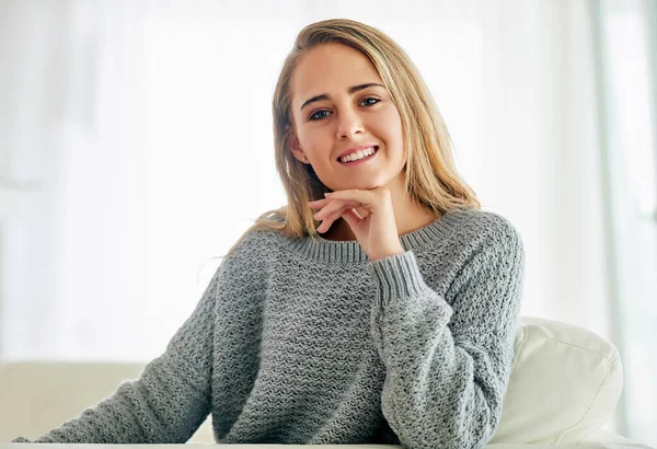 Im all about the weekend. Cropped portrait of an attractive young woman chilling on the sofa at home