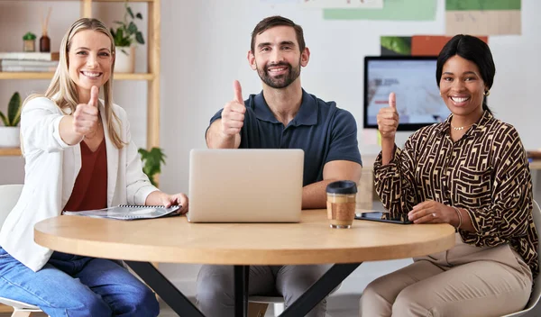 Teamwork, diversity and a thumbs up from a group of happy business people at a startup company. Motivation, collaboration and support from a winner team. Success in employee management in the office.