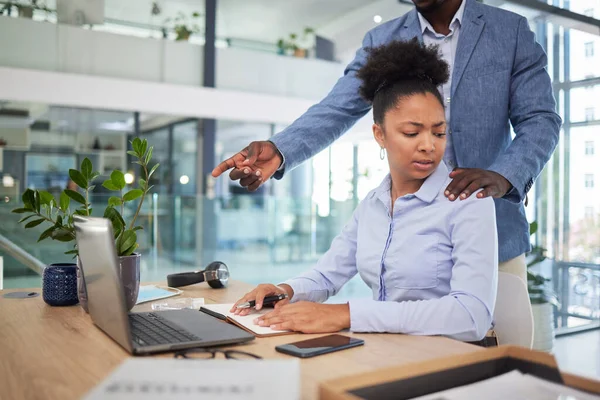 Workplace harassment, sexual abuse and unprofessional behavior from manager and business man touching a coworker in an office. Woman feeling uncomfortable, scared and worried about unwanted advances.