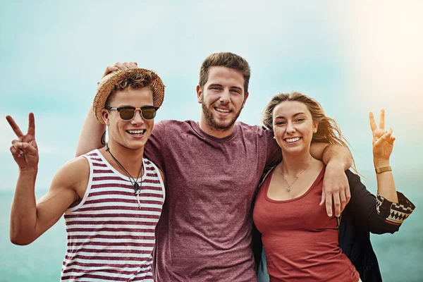 Friends fill life with the most fun. Portrait of a group of friends spending time together outdoors