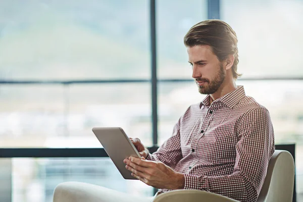 Working Some New Designs Handsome Young Businessman Using His Tablet — Stockfoto