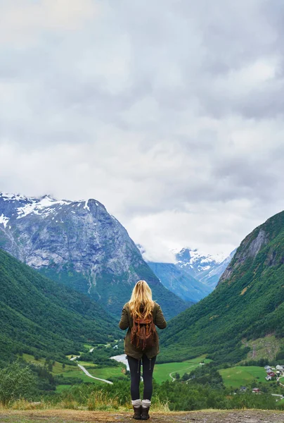 Travel adventure woman enjoying view of majestic glacial valley on exploration discover beautiful earth.