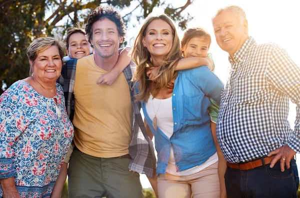 Family is the ultimate source of happiness. Portrait of three generations of family spending time together outdoors