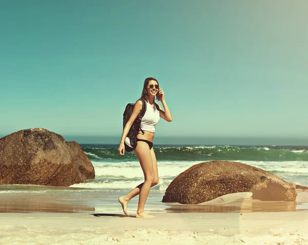 These moments you just live. a backpacker enjoying a day at the beach