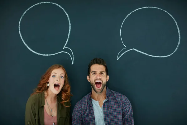 Weve Got Lot Shout Portrait Young Couple Standing Front Blackboard — Fotografia de Stock