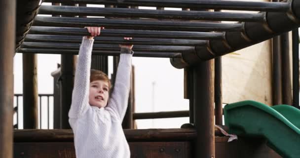 Boy Climbing Monkey Bars Jungle Gym Outdoors Kids Activity Park — Vídeo de Stock
