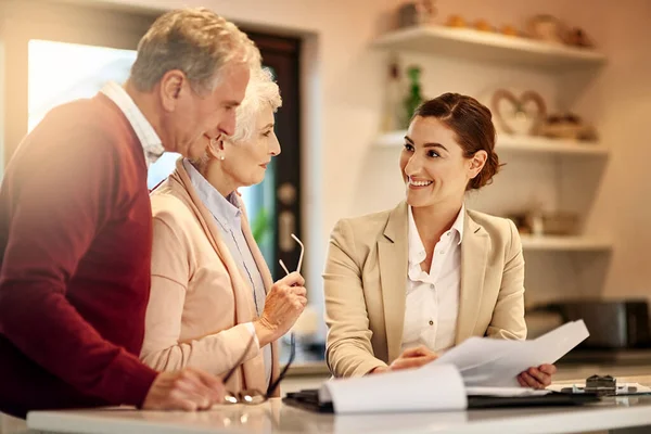 Planning for the future pays off. a senior couple getting advice from their financial consultant