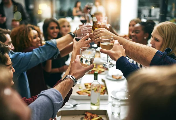 Heres to tonight. a group of young friends toasting during a dinner party at a restaurant
