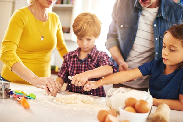 They share a love for baking. a family baking together at home