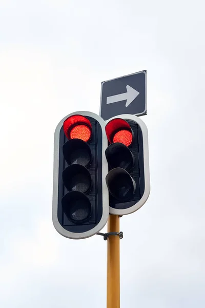 Stop in all directions. traffic lights against a gray sky