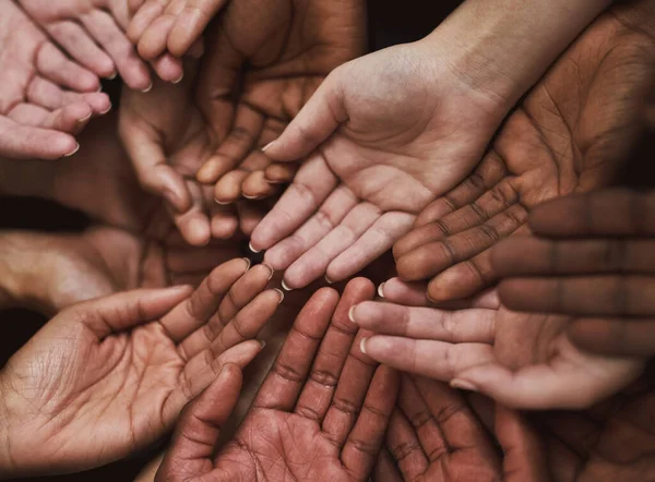 Pledge your support. a group of hands held cupped out together