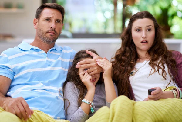 Dont watch this part. a father covering his daughters eyes while watching a movie