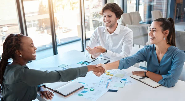 Business people, handshake and working together, deal or agreement in meeting. B2b, thank you and shaking hands in partnership, teamwork or collaboration together with client in corporate office
